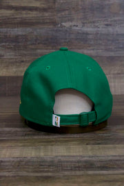 the back of the Boston Celtics 2019 City Series Dad Hat | Irish Green Adjustable Boston Celtics Baseball Cap with Golden Shamrock has a matching NBA tag on the strap
