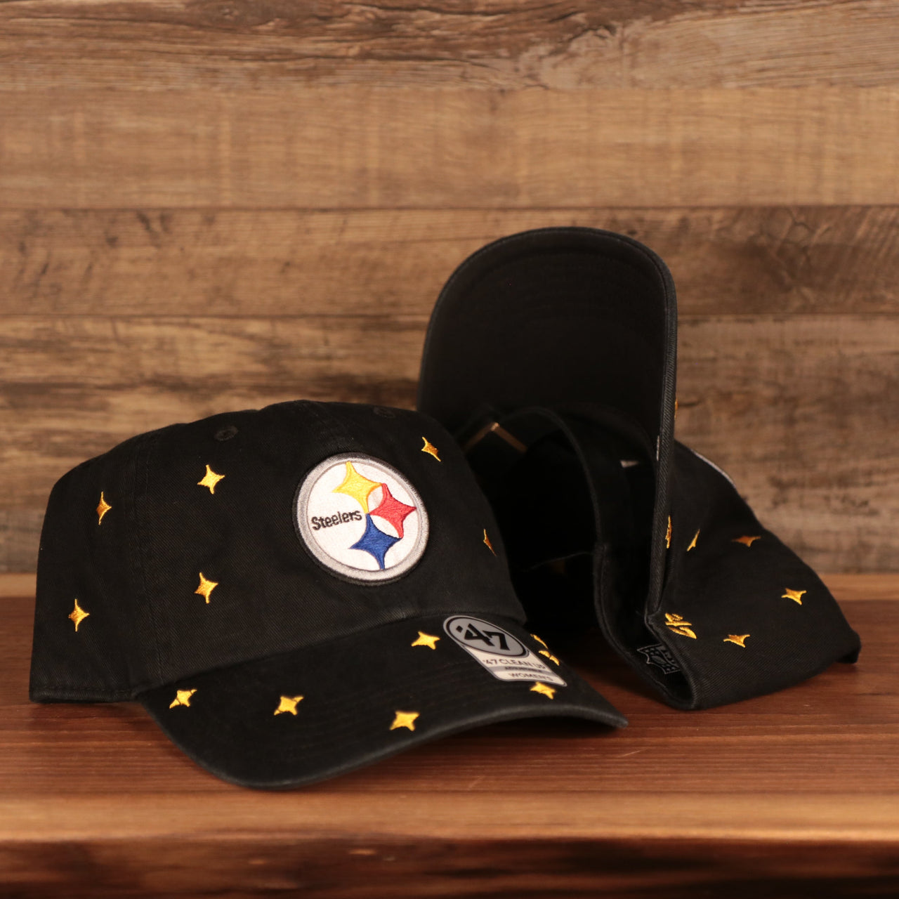 front and back of the Pittsburgh Steelers All Over Logo Patch Black Adjustable Dad Hat