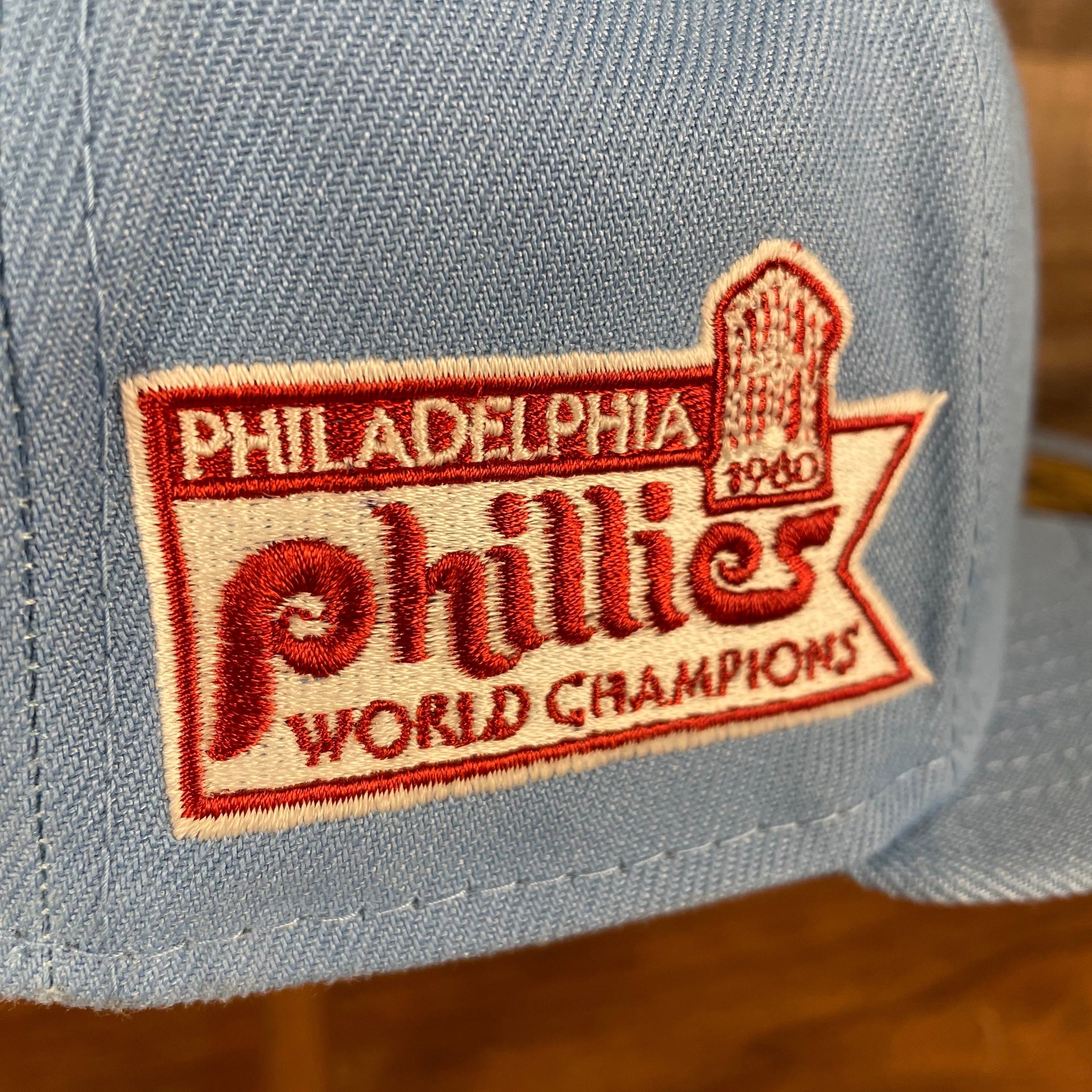 Close up of the 1980 Phillies World Champions Side Patch on the Philadelphia Phillies 1980 World Champions Side Patch Cooperstown Quaker Logo Maroon Bottom Sky 59Fifty Fitted Cap
