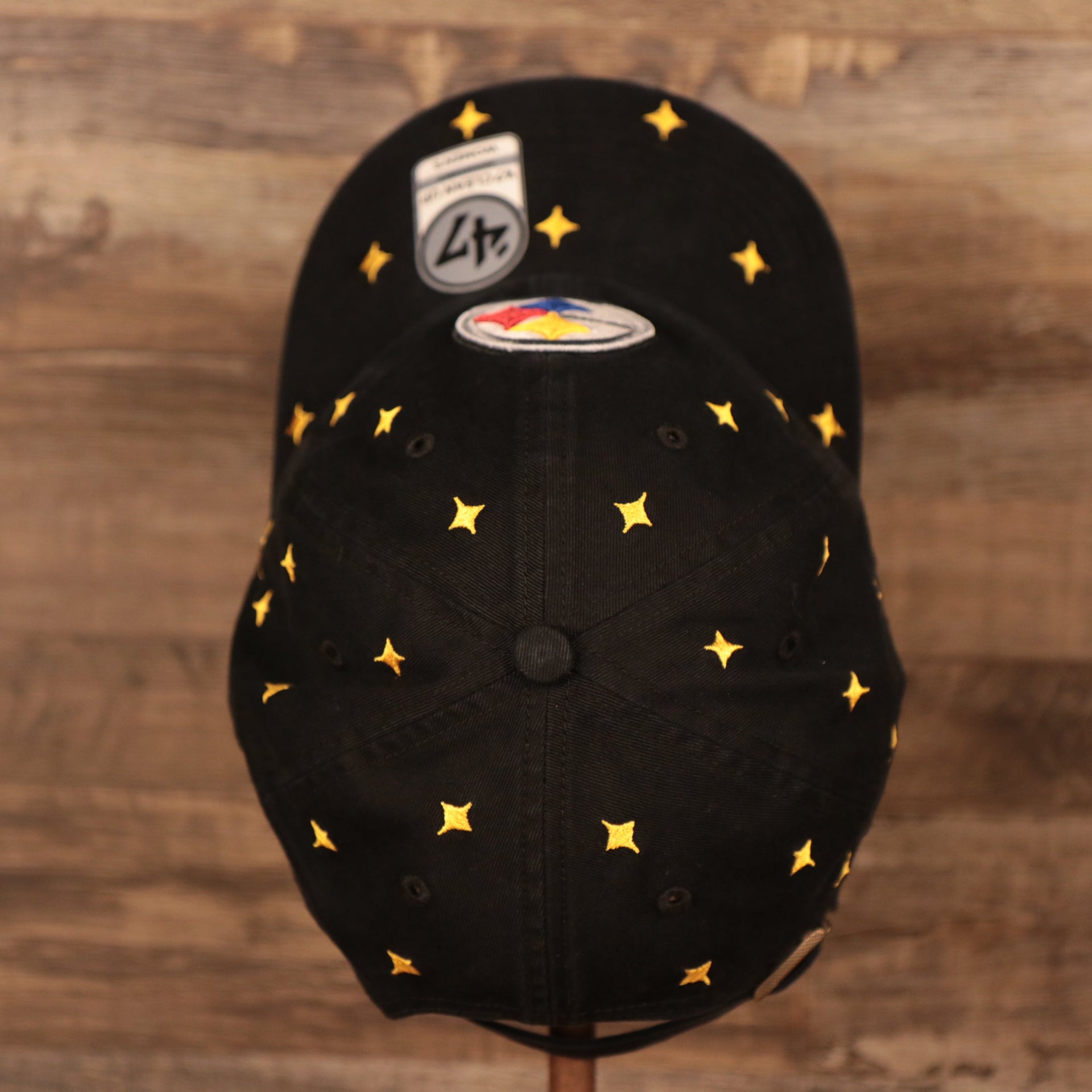 top view of the Pittsburgh Steelers All Over Logo Patch Black Adjustable Dad Hat