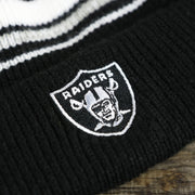 raiders logo on the Kid’s Oakland Raiders Striped Cuffed Winter Beanie With Pom Pom | Kid’s  Black And Gray Winter Beanie