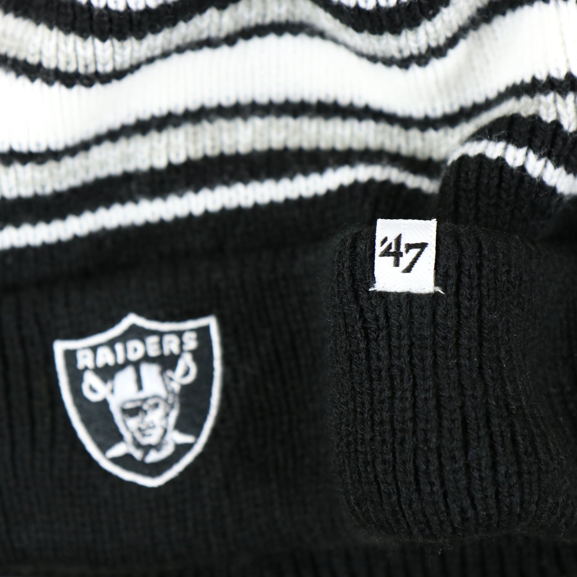 47 brand label on the Kid’s Oakland Raiders Striped Cuffed Winter Beanie With Pom Pom | Kid’s  Black And Gray Winter Beanie
