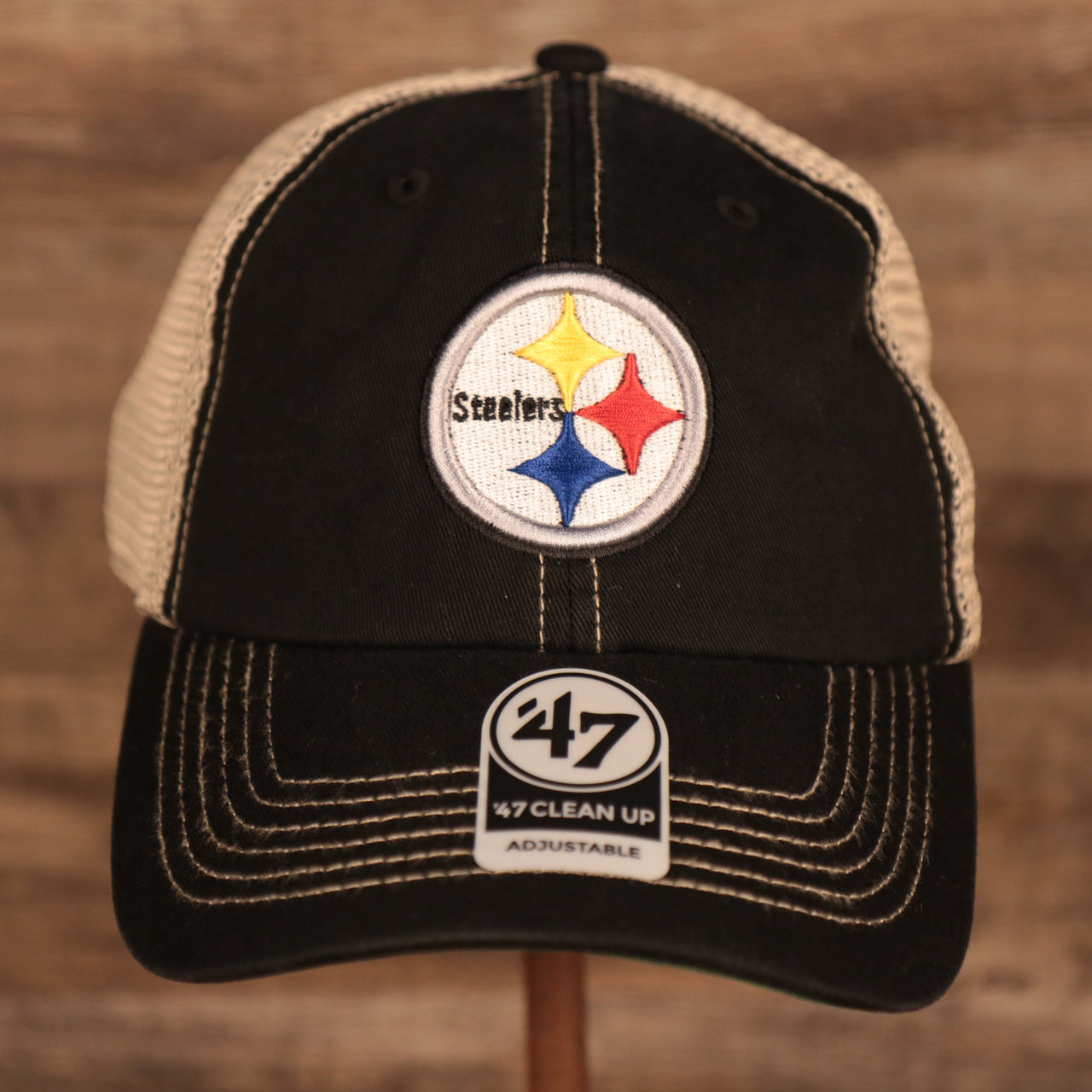 front of the Pittsburgh Steelers Black Adjustable Green Bottom Trucker Dad Hat