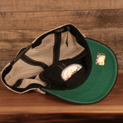 underside of the Pittsburgh Steelers Black Adjustable Green Bottom Trucker Dad Hat