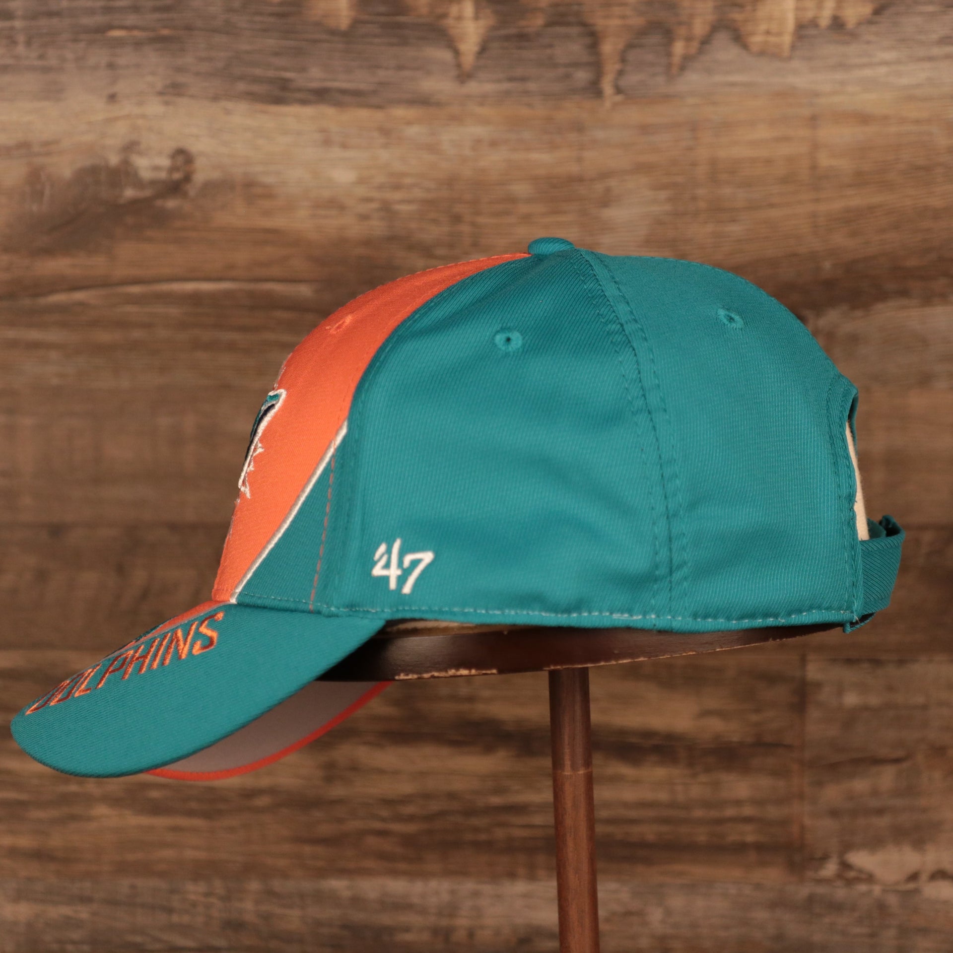 wearers left side of the Miami Dolphins Orange and Teal Adjustable Dad Hat