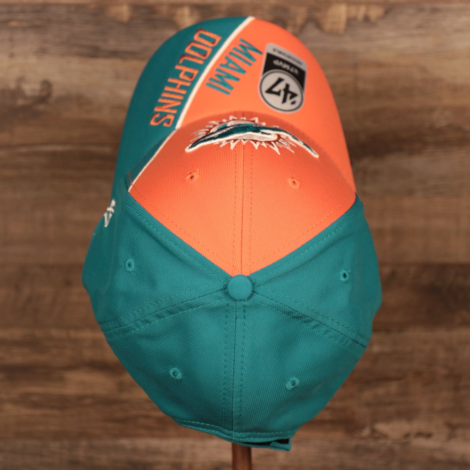 top view of the Miami Dolphins Orange and Teal Adjustable Dad Hat