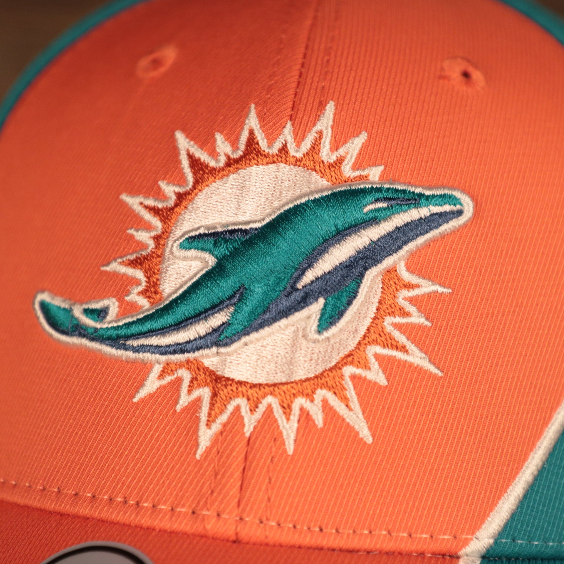 logo shot of the Miami Dolphins Orange and Teal Adjustable Dad Hat