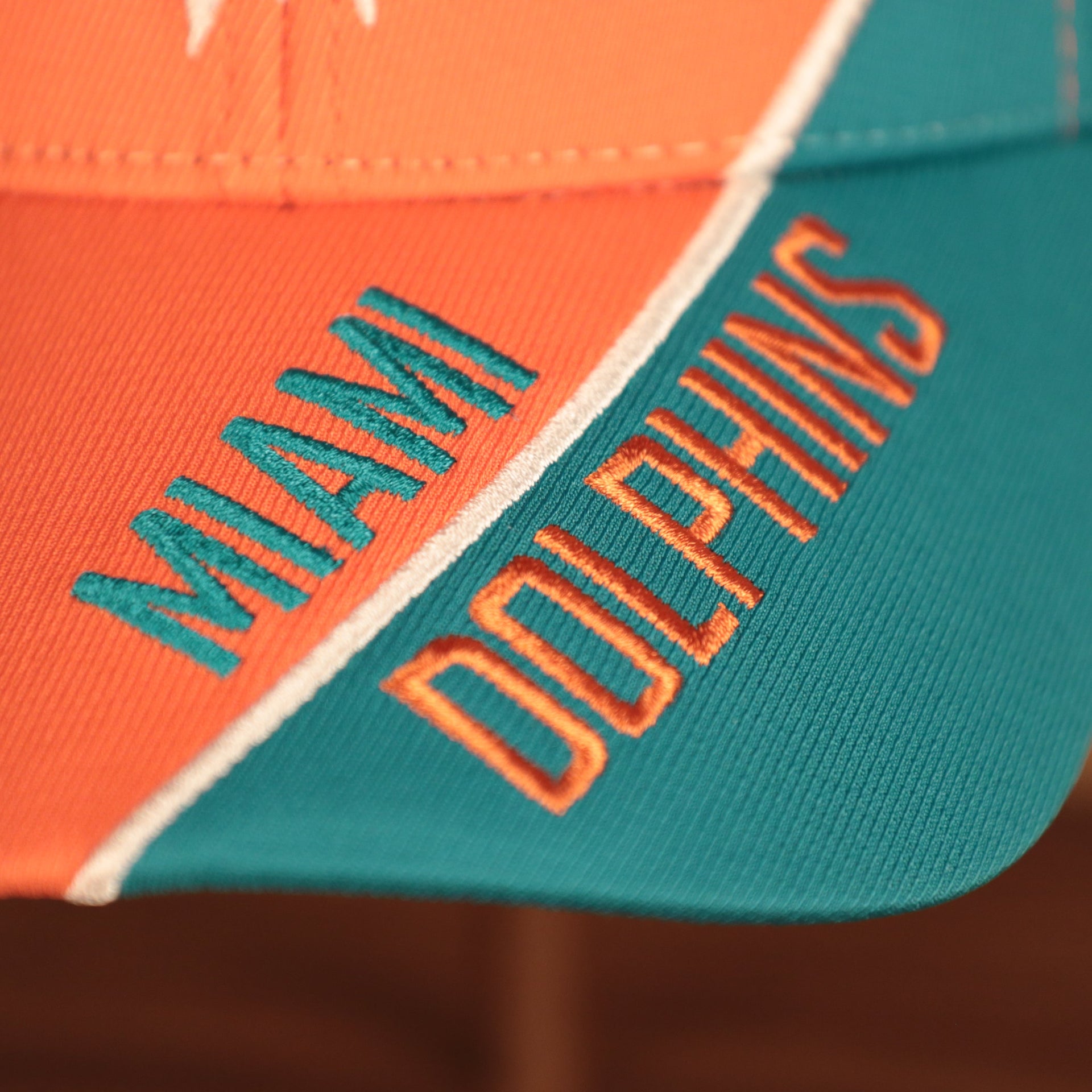brim shot of the Miami Dolphins Orange and Teal Adjustable Dad Hat