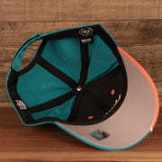 underside of the Miami Dolphins Orange and Teal Adjustable Dad Hat
