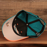 underside of the Miami Dolphins Orange and Teal Adjustable Dad Hat