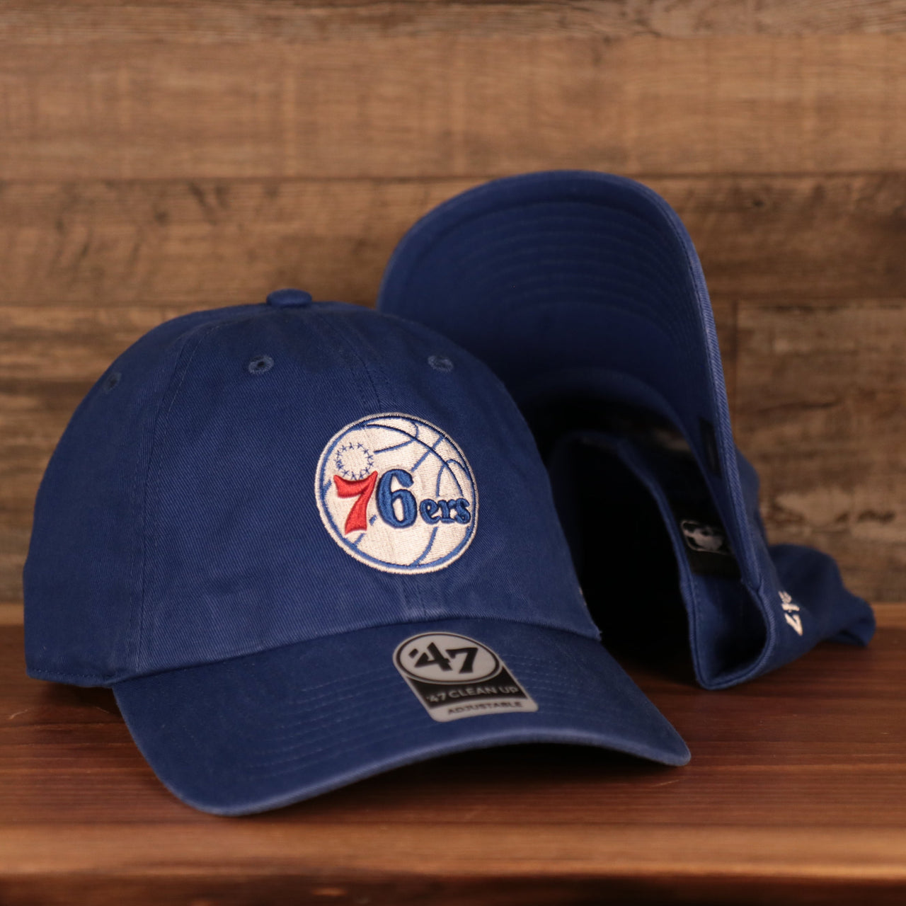 front of the Philadelphia 76ers Blue Adjustable Dad Hat