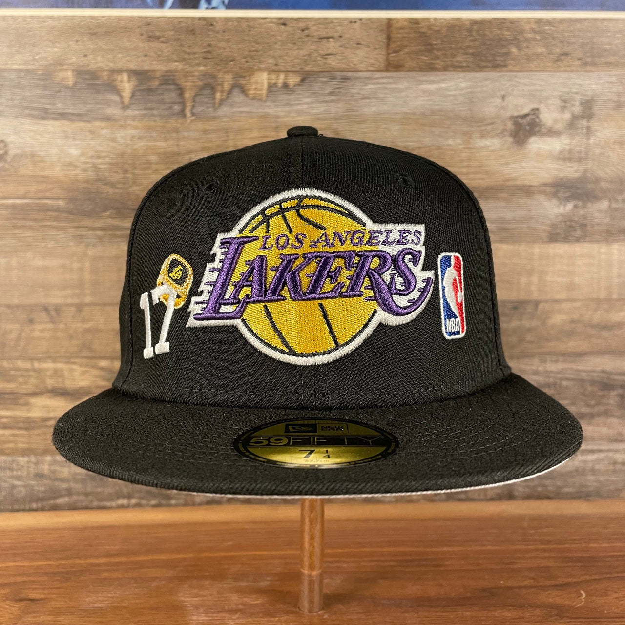 front of the Los Angeles Lakers "Championship Rings" All Over Side Patch Gray Bottom 59FIFTY Fitted Cap