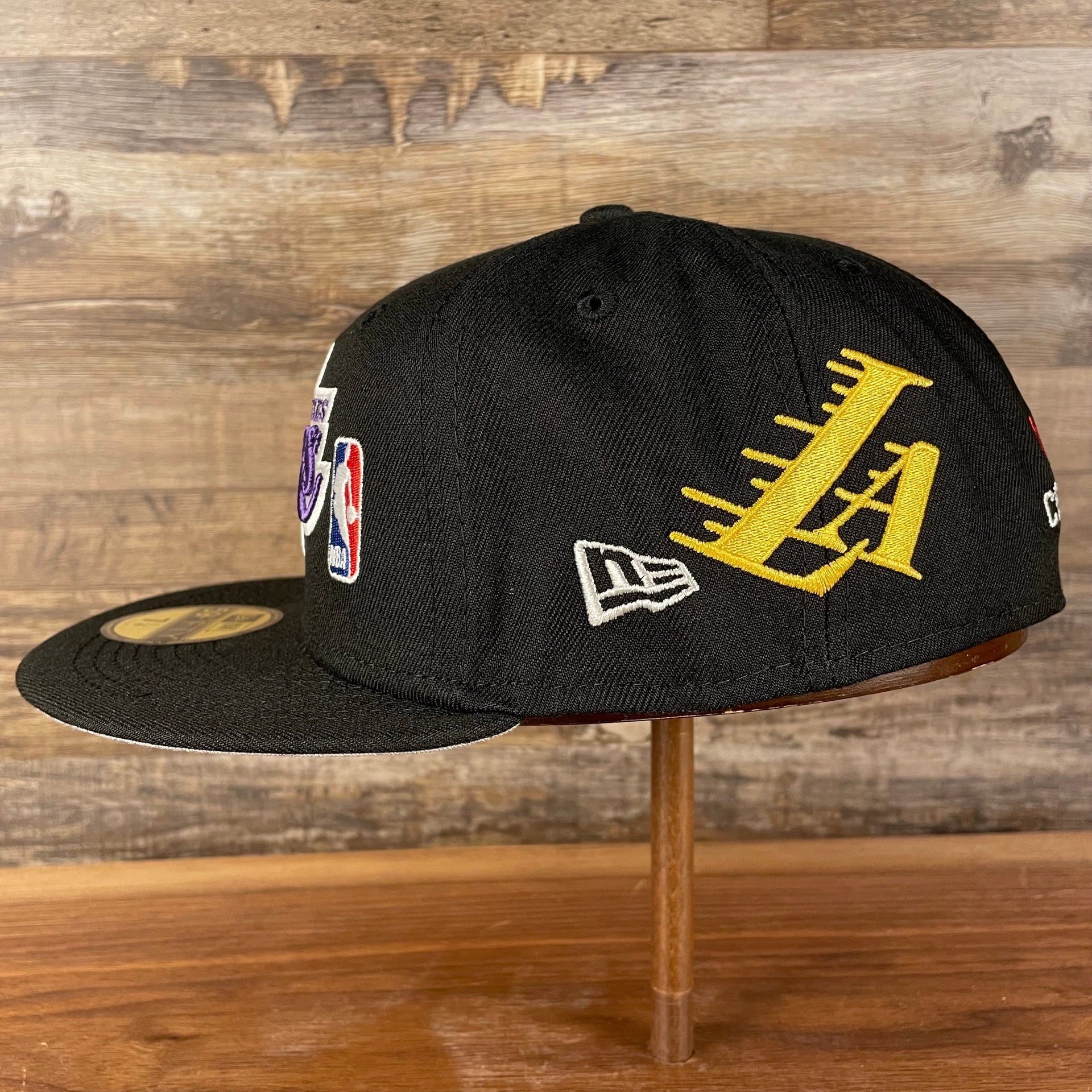 wearers left side Los Angeles Lakers "Championship Rings" All Over Side Patch Gray Bottom 59FIFTY Fitted Cap