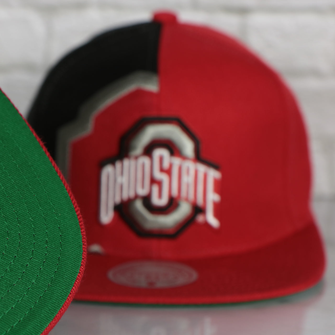 green under visor on the Ohio State Buckeyes Retroline Logo Outline Vintage Snapback Hat | Mitchell and Ness Buckeyes Snap Cap