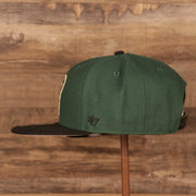 wearers left side on the Milwaukee Bucks Dark Green and Black Adjustable Grey Bottom Snapback Hat