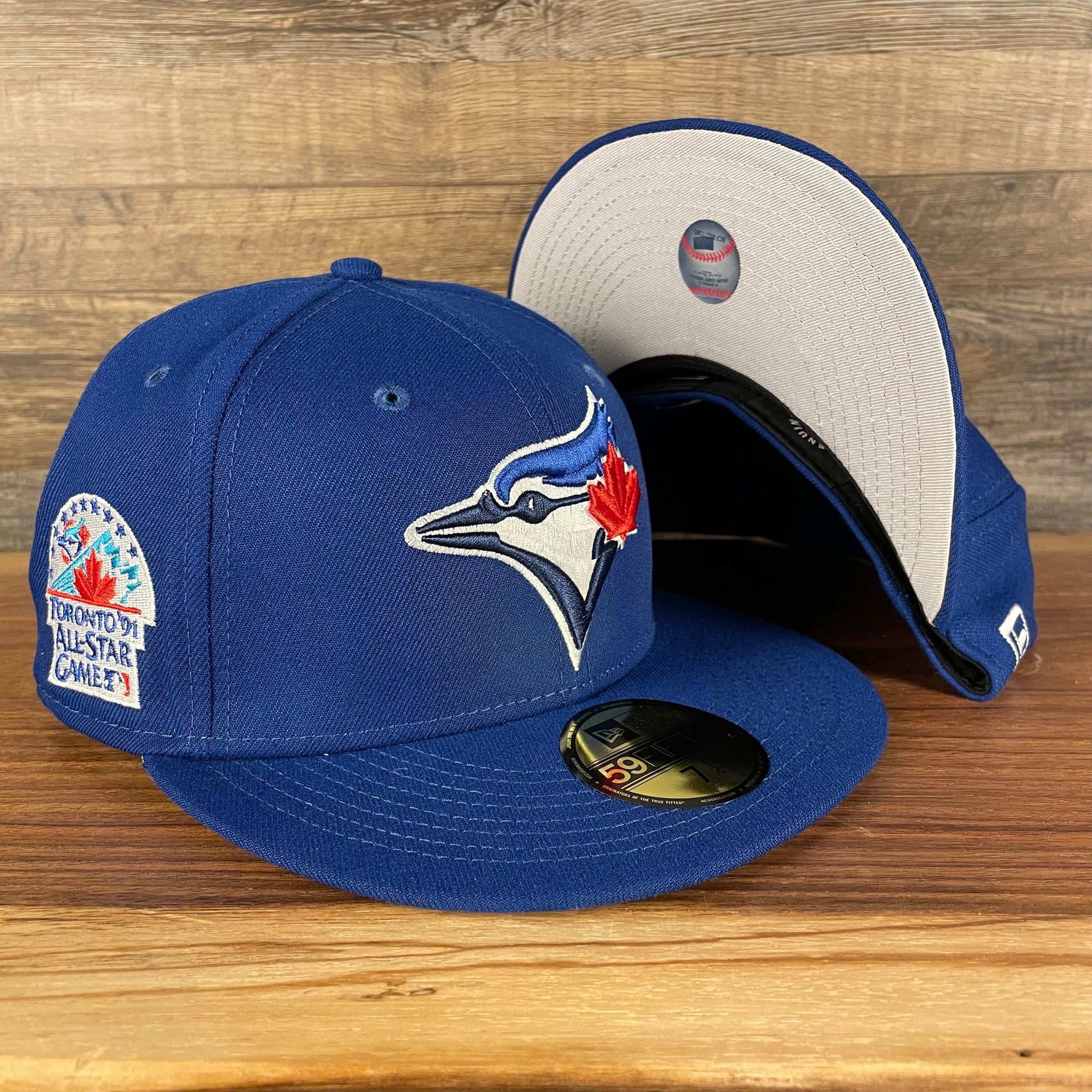front and bottom of the Toronto Blue Jays "Patch Up" 1991 All Star Game Side Patch Gray Bottom 59Fifty Royal Fitted Cap