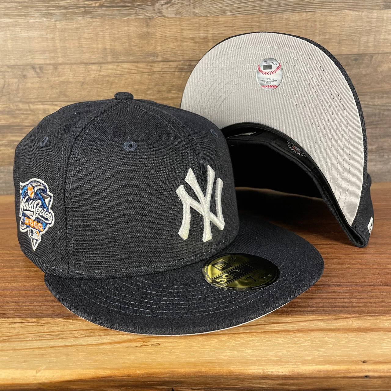 front and bottom of the New York Yankees "Patch Up" 2000 World Series Side Patch Gray Bottom 59Fifty Navy Fitted Cap