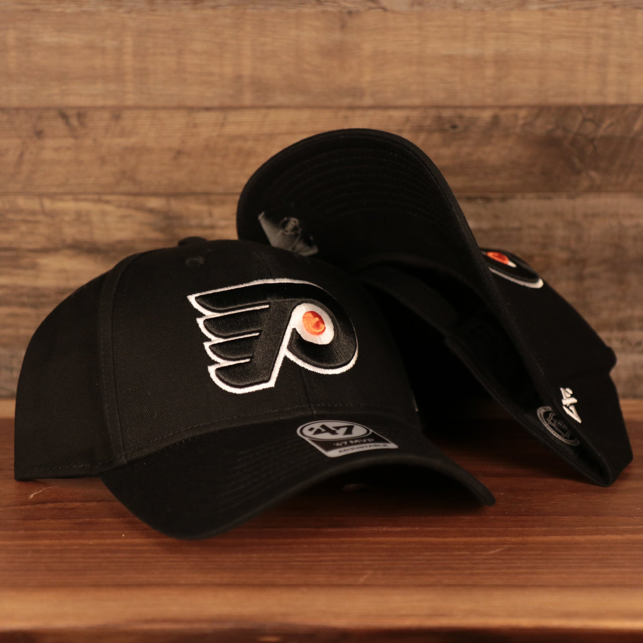front and bottom of the Philadelphia Flyers Black Adjustable Dad Hat