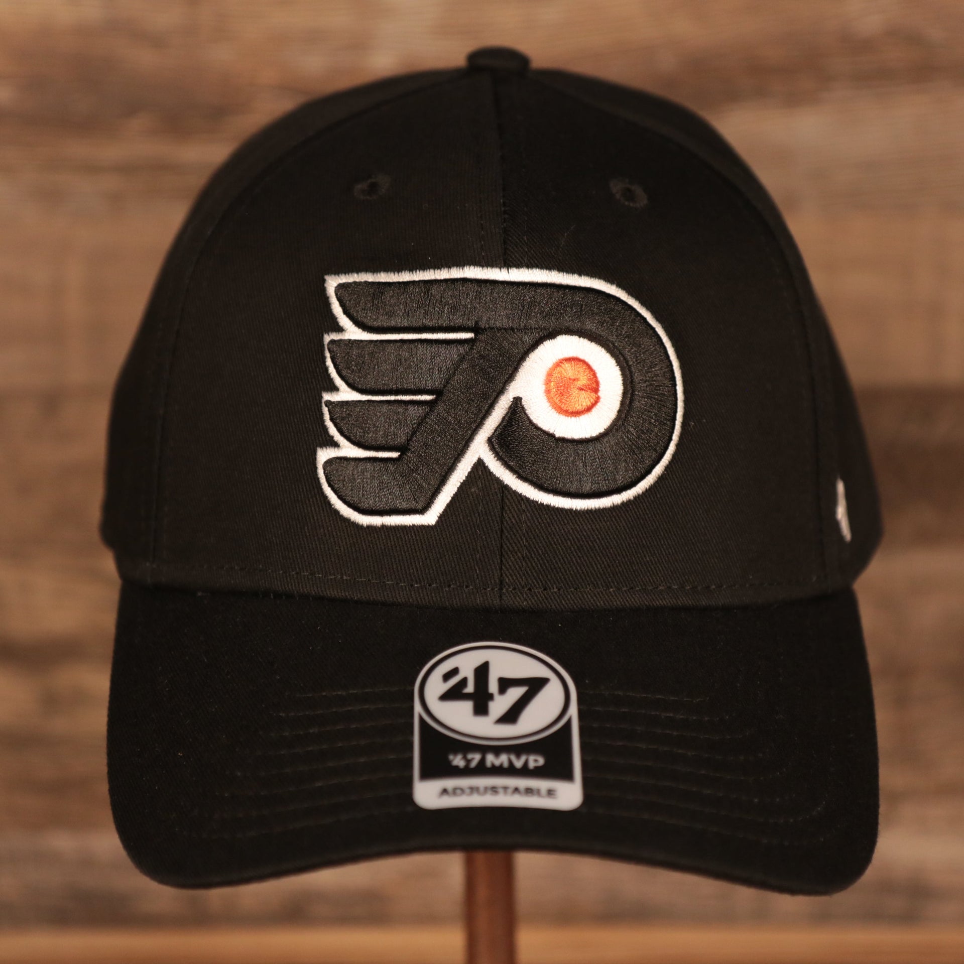 front of the Philadelphia Flyers Black Adjustable Dad Hat