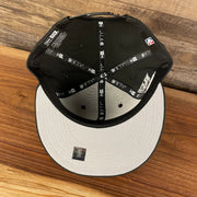 Gray under visor of the Brooklyn Nets NBA 75th Anniversary Side Patch Gray Bottom Black 9Fifty Snapback Hat | Back Half