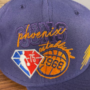 Close up of the side patch on the Phoenix Suns NBA 75th Anniversary Side Patch Gray Bottom Purple 9Fifty Snapback Hat | Back Half