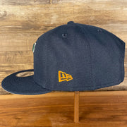 Wearer's left of the Utah Jazz NBA 75th Anniversary Side Patch Gray Bottom Navy 9Fifty Snapback Hat | Back Half