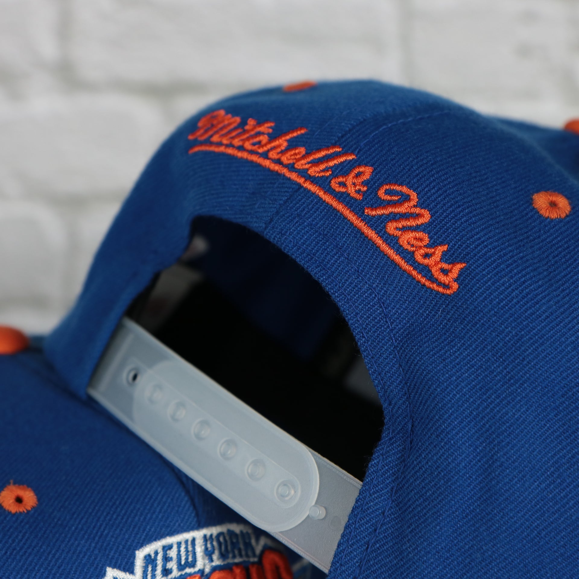 mitchell and ness logo on the New York Knicks Snapback Hat | 3M Reflective Mitchell and Ness Vintage Knicks Snapback Cap