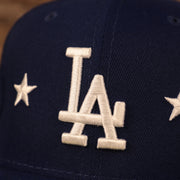 Close up of the LA logo and star embroideries on the Los Angeles Dodgers City Transit All Over Side Patch Gray Bottom 59Fifty Fitted Cap