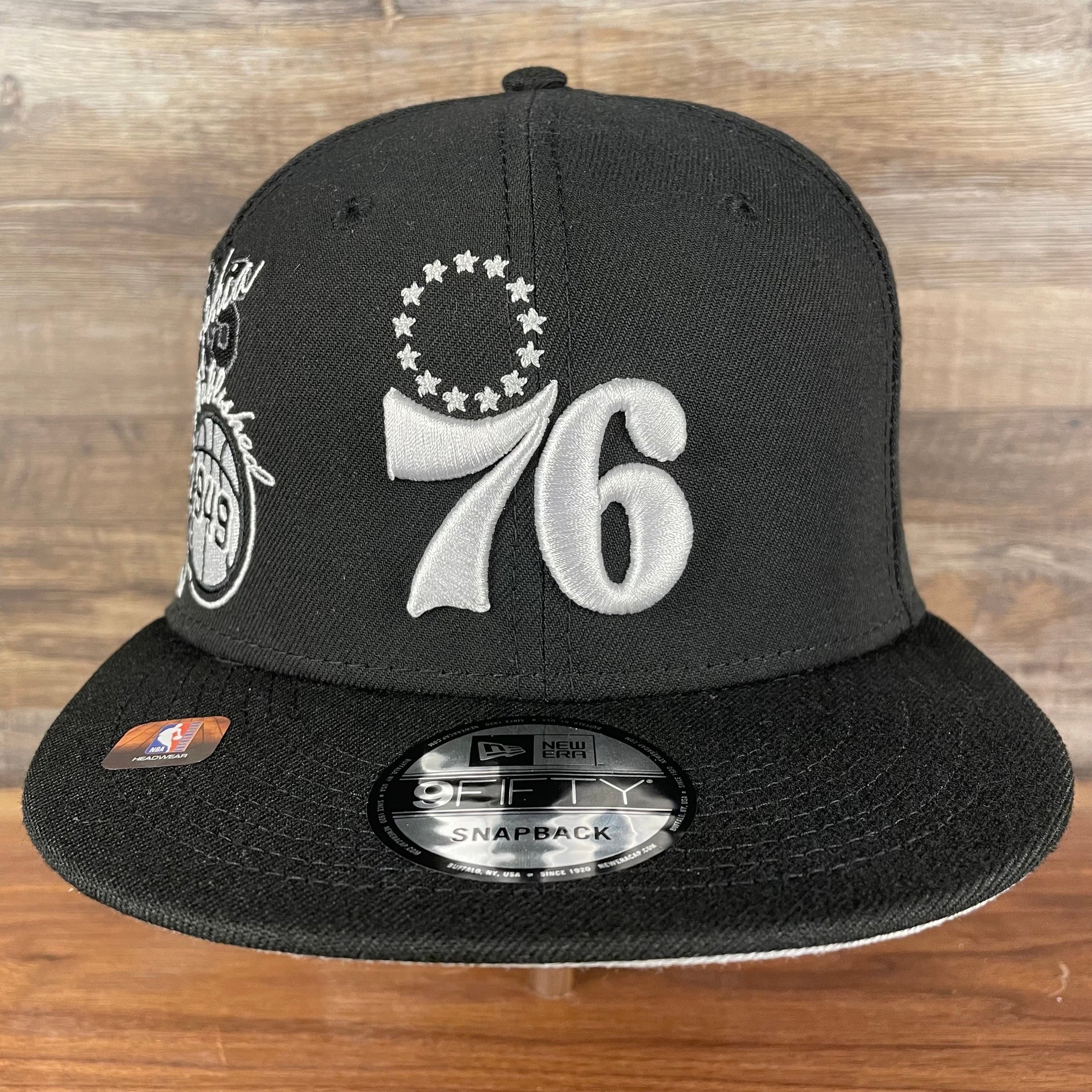 Front of the Philadelphia 76ers NBA 75th Anniversary Side Patch Gray Bottom Black 9Fifty Snapback Hat | Back Half