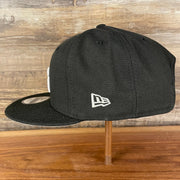 Wearer's left of the Philadelphia 76ers NBA 75th Anniversary Side Patch Gray Bottom Black 9Fifty Snapback Hat | Back Half