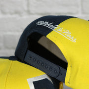 mitchell and ness logo on the University of Michigan Wolverines Retroline Logo Outline Vintage Snapback Hat | Mitchell and Ness Wolverines Snap Cap