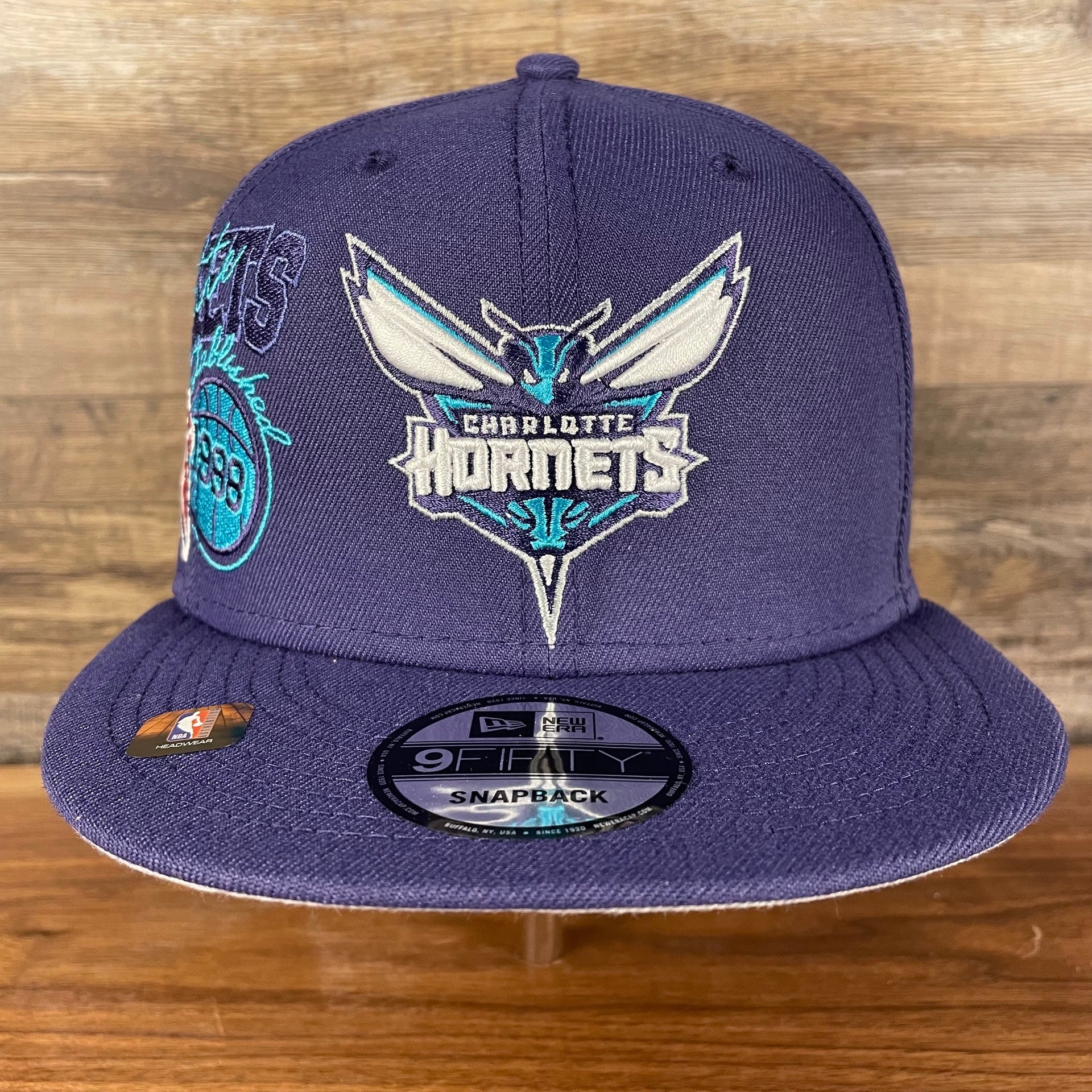 Front of the Charlotte Hornets NBA 75th Anniversary Side Patch Gray Bottom Purple 9Fifty Snapback Hat | Back Half