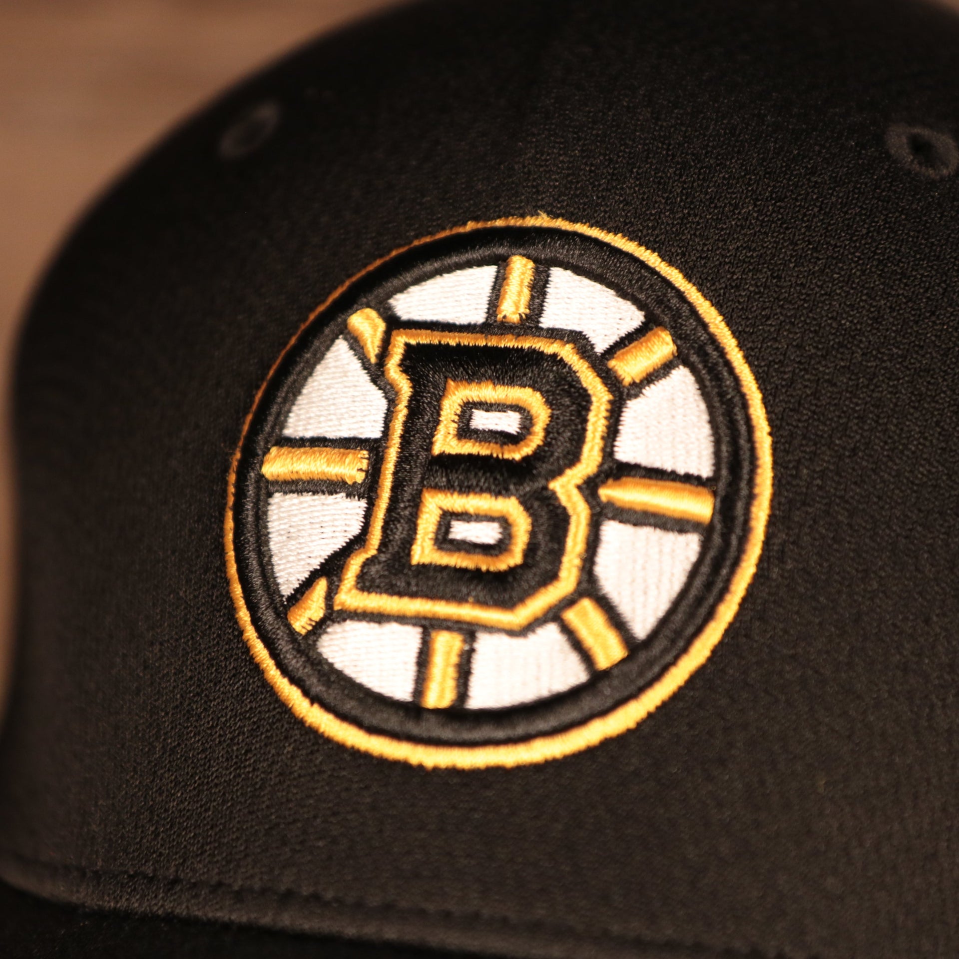 logo shot on the Boston Bruins Black & Yellow Stretch Fit Dad Hat