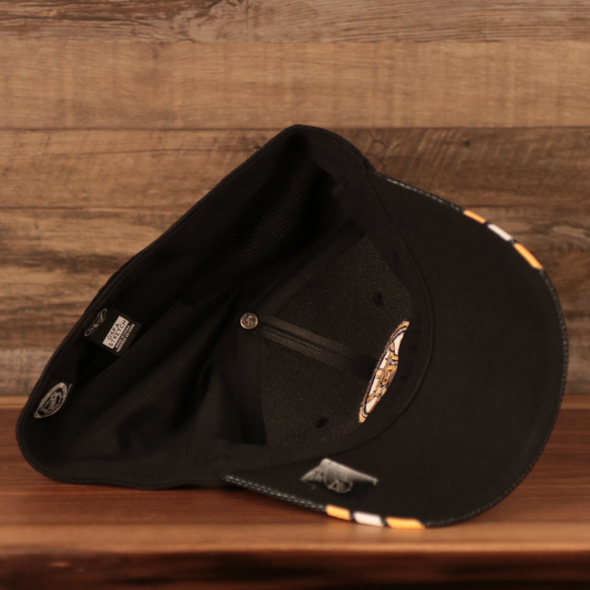 underside of the Boston Bruins Black & Yellow Stretch Fit Dad Hat