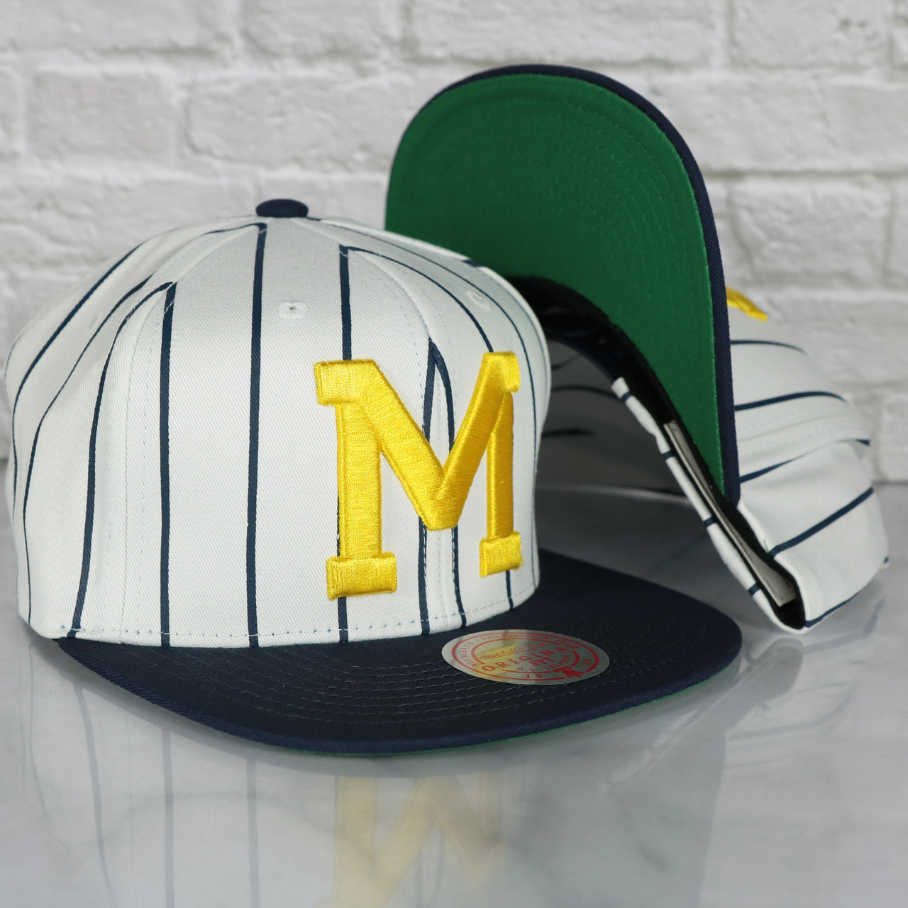 University of Michigan Wolverines Vintage Pinstripe Baseball Hat | Retro Mitchell and Ness White Pinstripe Snapback Hat