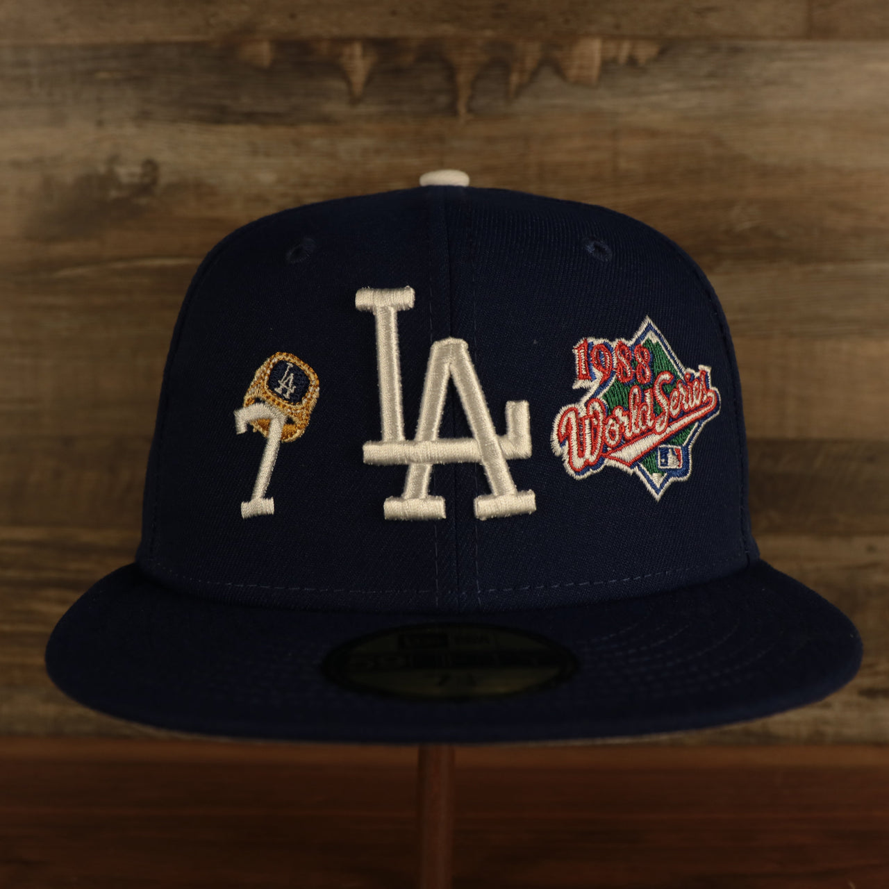 front view of the Los Angeles Dodgers Cooperstown "Championship Rings" All Over Side Patch Gray Bottom 59FIFTY Fitted Cap