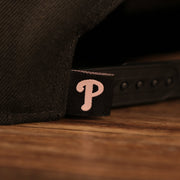 Close up of the Phillies logo label on the Philadelphia Phillies 2008 World Series Side Patch Drip Logo Pink Bottom 9Fifty Snapback Hat