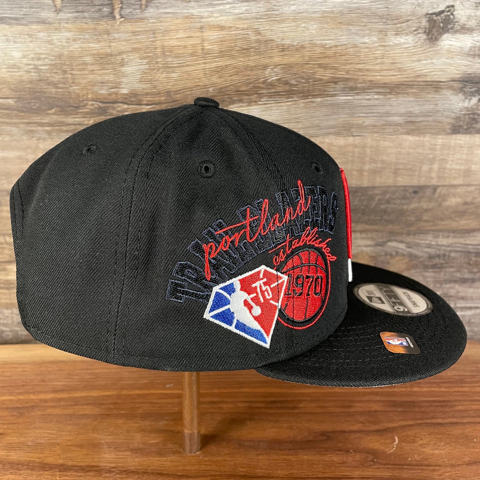 Wearer's right of the Portland Trail Blazers NBA 75th Anniversary Side Patch Gray Bottom Black 9Fifty Snapback Hat | Back Half