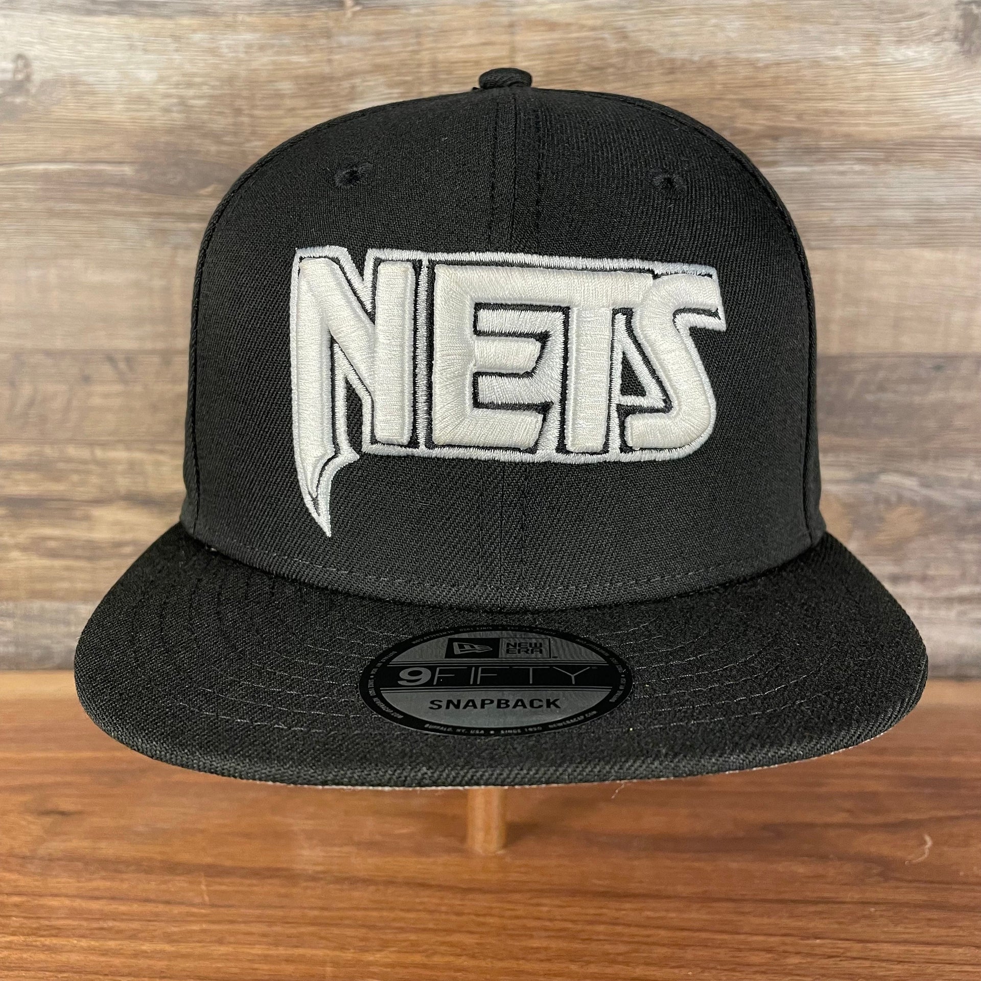 Front of Brooklyn Nets NBA 75th Anniversary 2012 Side Patch Gray Bottom Black 9Fifty Snapback Hat | City Edition