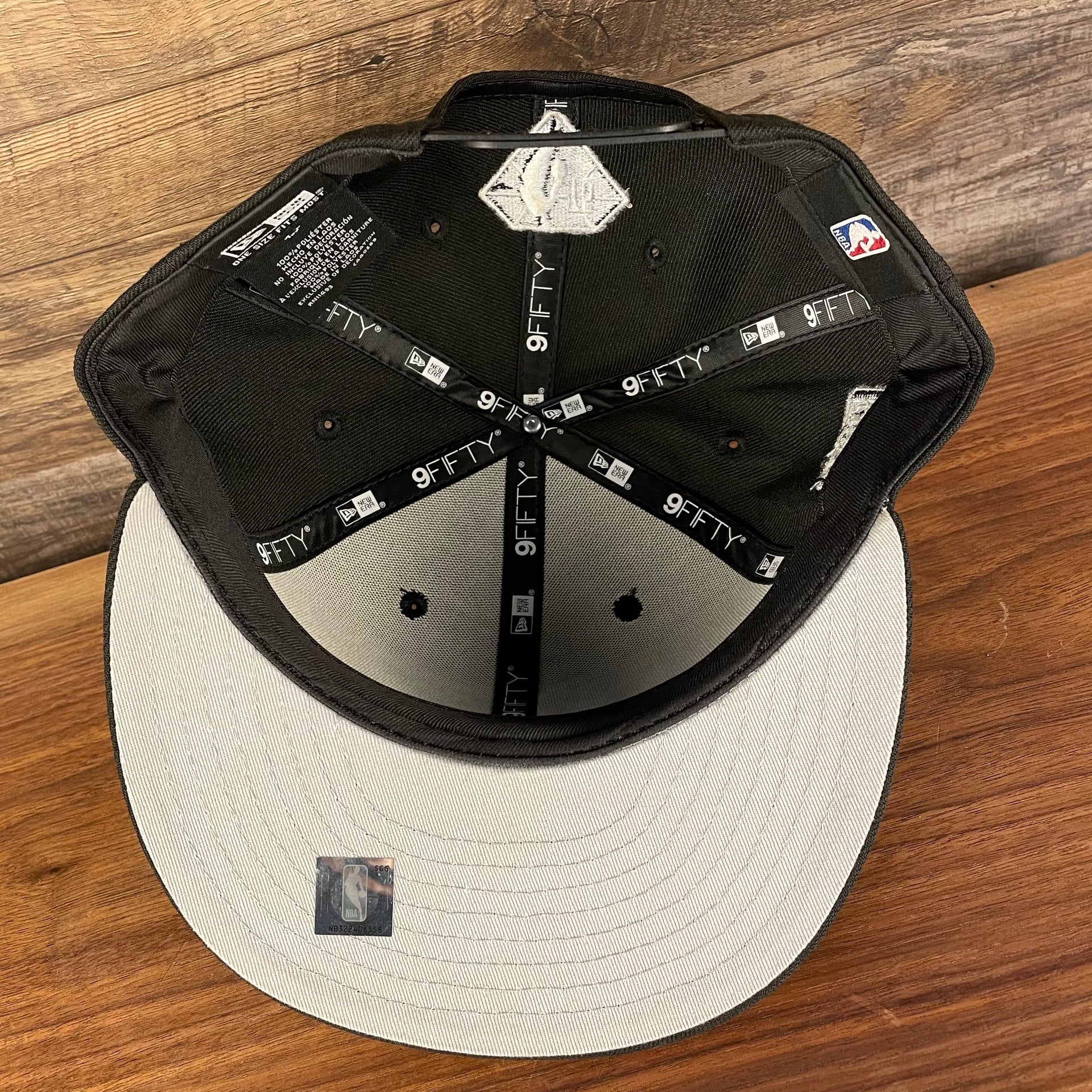 Grey under visor of the Brooklyn Nets NBA 75th Anniversary 2012 Side Patch Gray Bottom Black 9Fifty Snapback Hat | City Edition