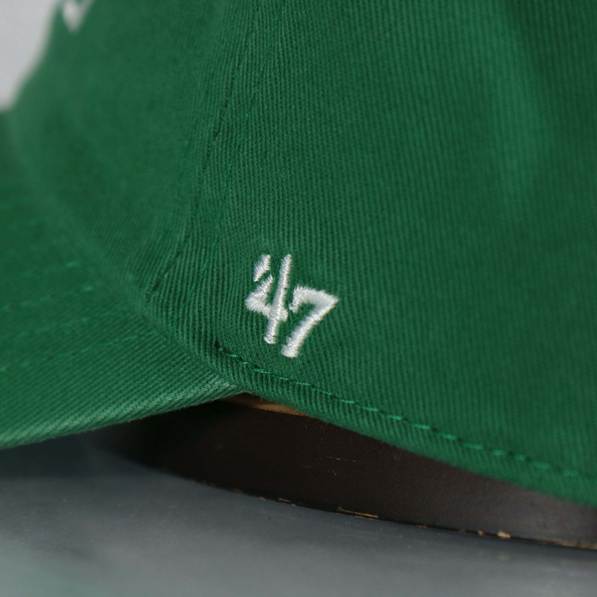 Close up of the '47 logo on the Philadelphia Eagles Throwback Logo "Fly Eagles Fly" Kelly Green Retro Clean Up Dad Hat