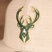 bucks logo on the front of the Milwaukee Bucks Gray Adjustable Gray Bottom Snapback