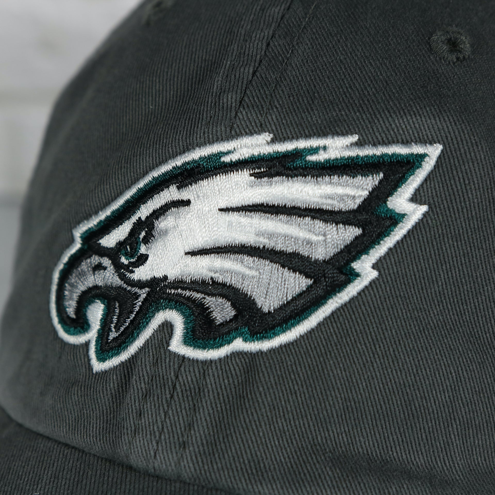 Close up of the front Eagles logo on the Philadelphia Eagles Super Bowl LVII (Super Bowl 57) Side Patch Charcoal Clean Up Dad Hat