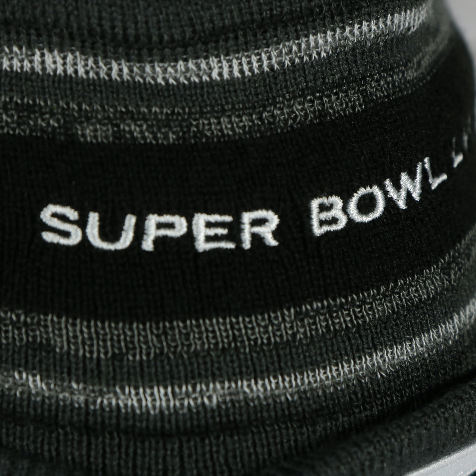 Close up of the Super Bowl embroidery on the Philadelphia Eagles Super Bowl LVII (Super Bowl 57) Side Patch Charcoal Winter Beanie