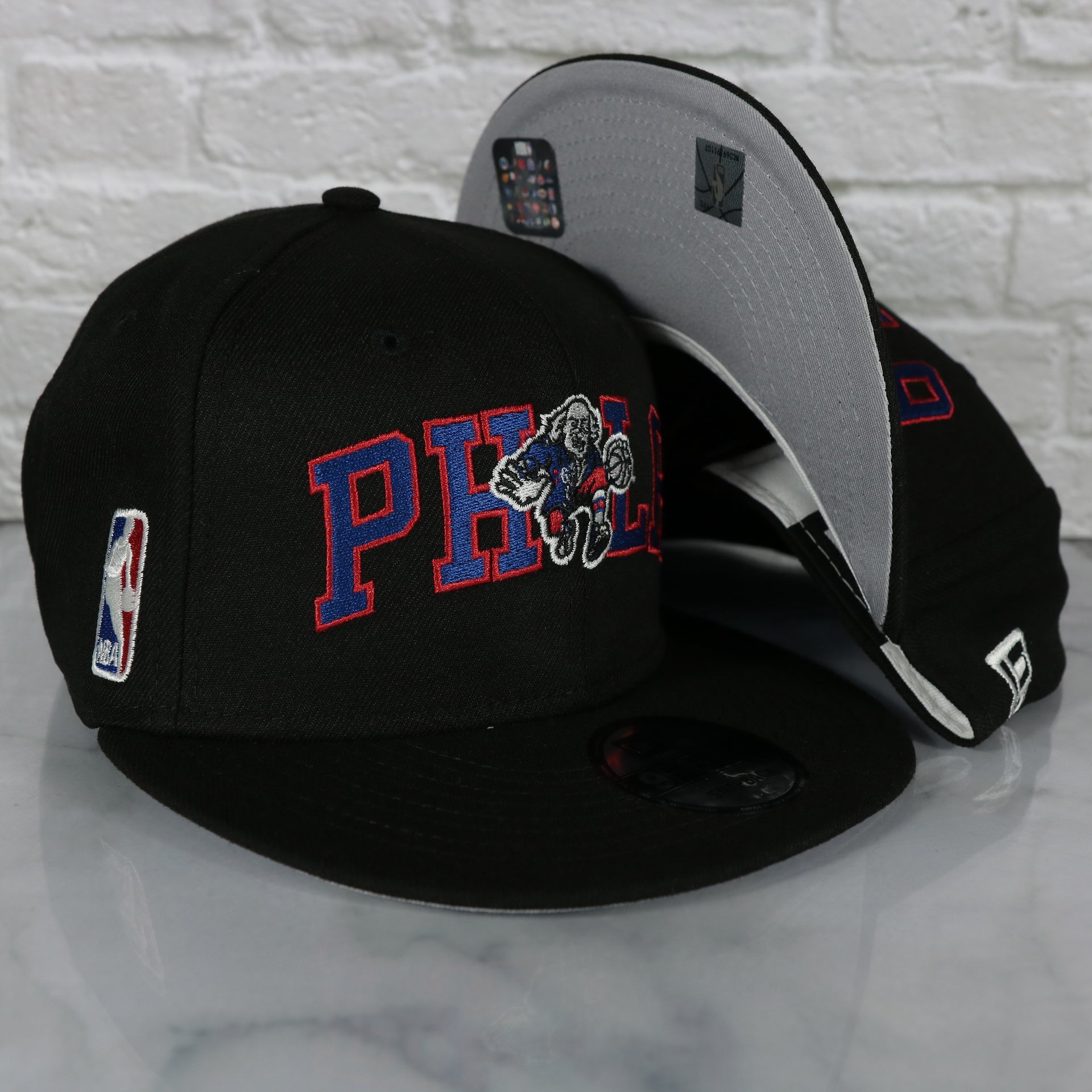 Philadelphia 76ers Wordmark Logo Blend Grey Bottom 9Fifty Snapback Cap | Black 950 Snap Cap