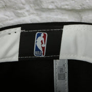 NBA label on the Philadelphia 76ers Wordmark Logo Blend Grey Bottom 9Fifty Snapback Cap | Black 950 Snap Cap