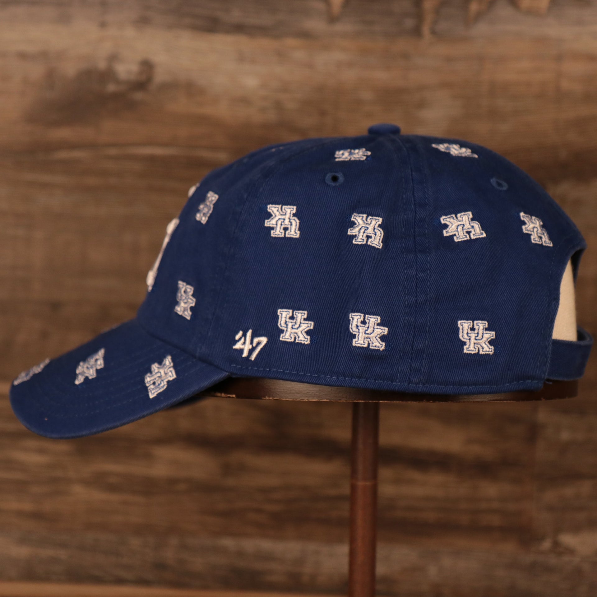 wearers left side of the University of Kentucky Wildcats All Over Logo Patch Blue Adjustable Dad Hat