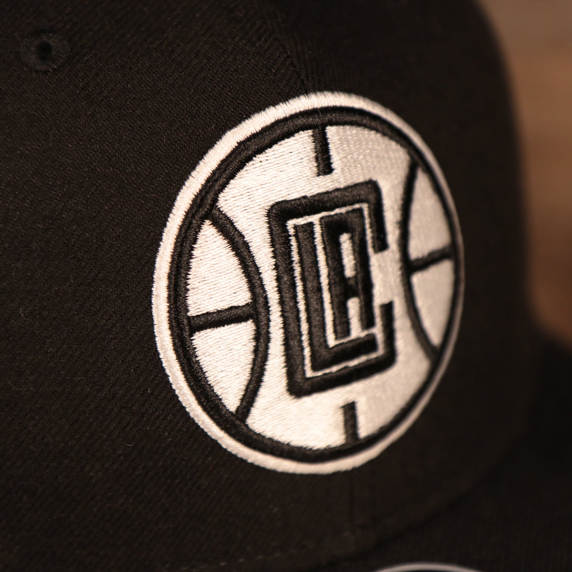 logo shot on the Los Angeles Clippers Black Adjustable Grey Bottom Snapback Hat