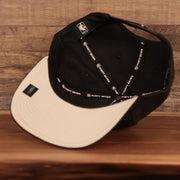 underside of the Los Angeles Clippers Black Adjustable Grey Bottom Snapback Hat