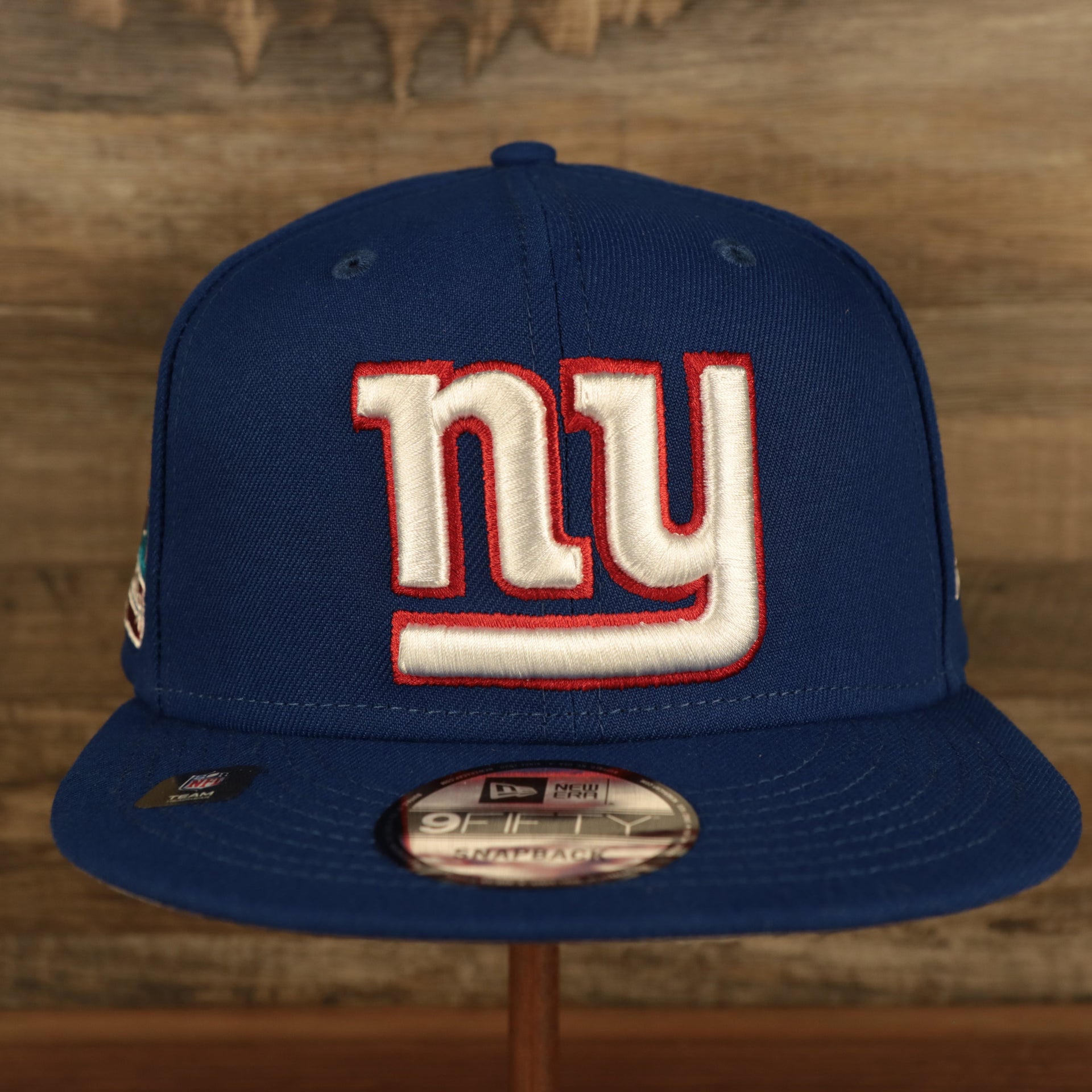 front of the New York Giants "Patch Up" Super Bowl XLII Side Patch Gray Bottom 59Fifty Royal Fitted Cap